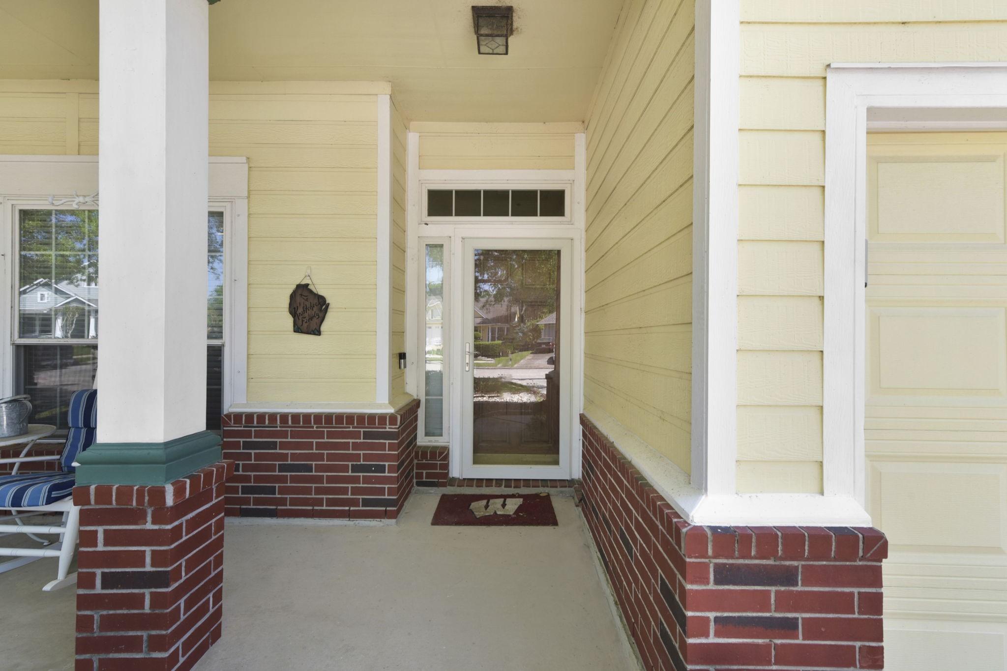 Image 4: Welcoming front door entryway with a classic South