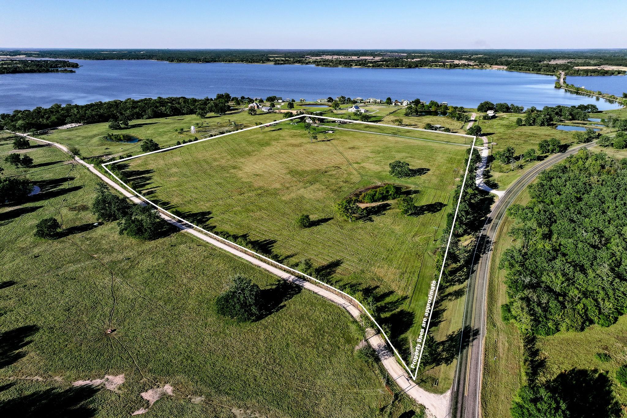 Image 2: Situated atop the hill with panoramic lake views,