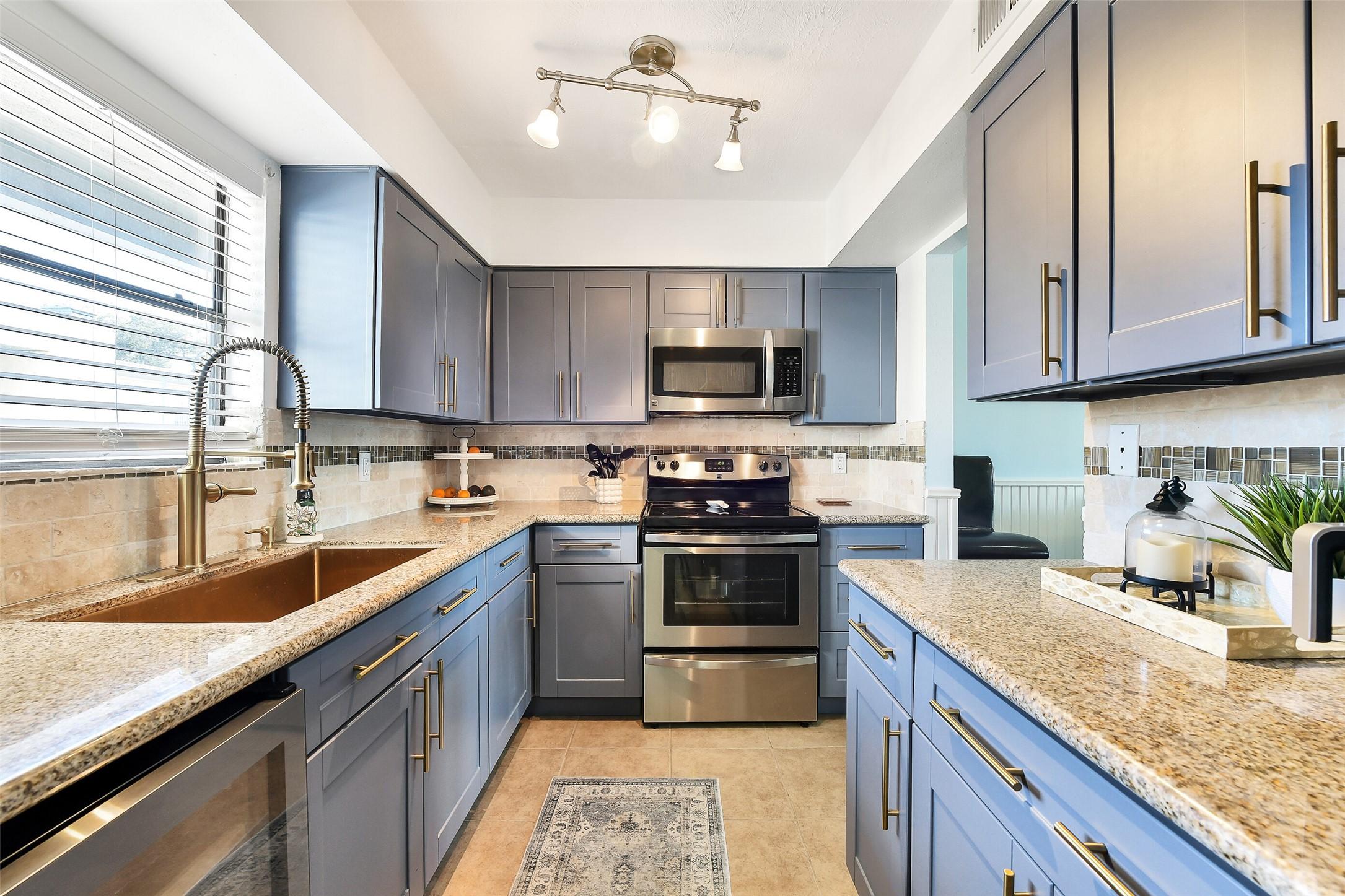 Image 4: Updated kitchen with painted cabinetry, new sink a