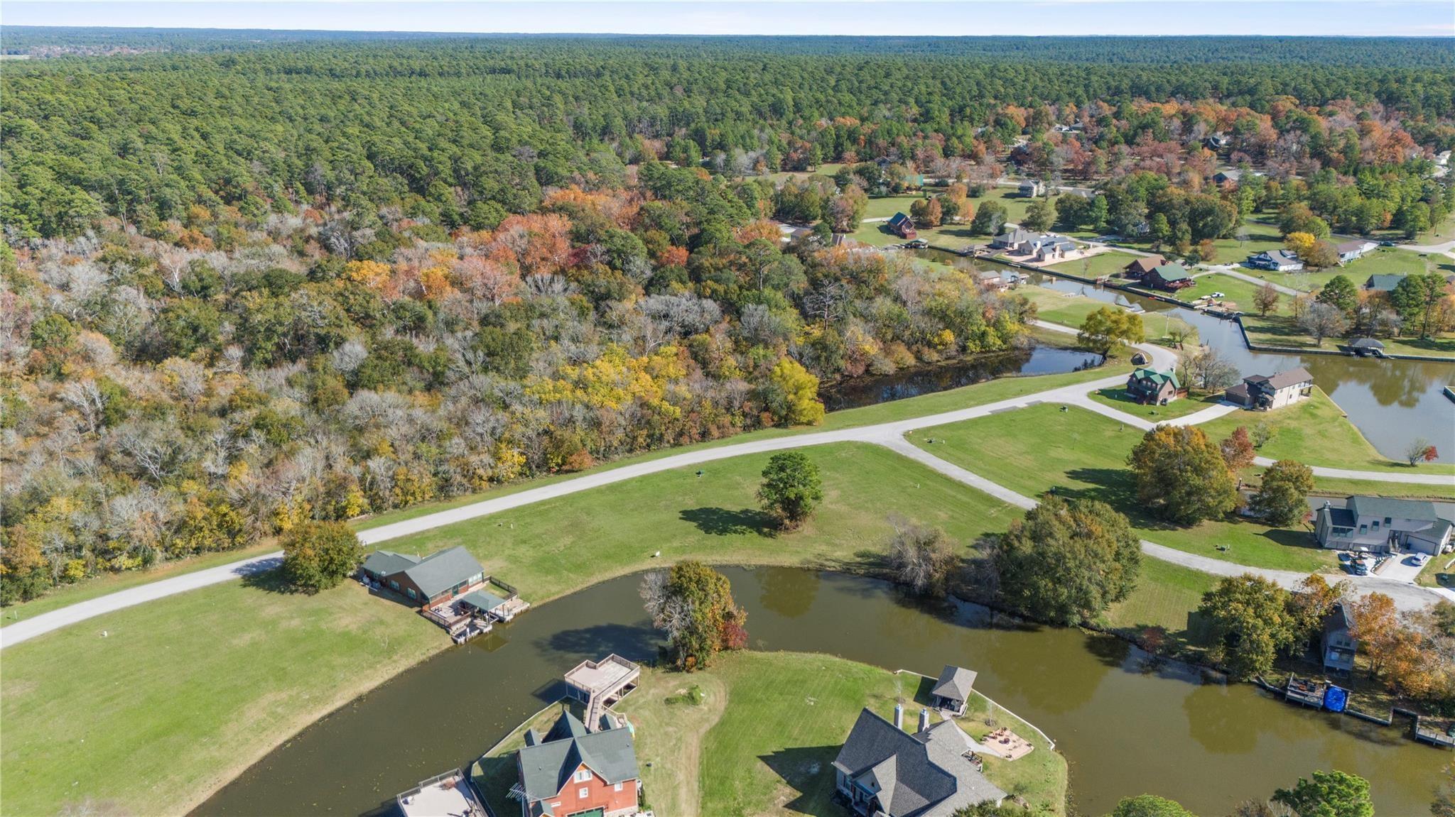 Image 2: Oversized corner lot with canal frontage