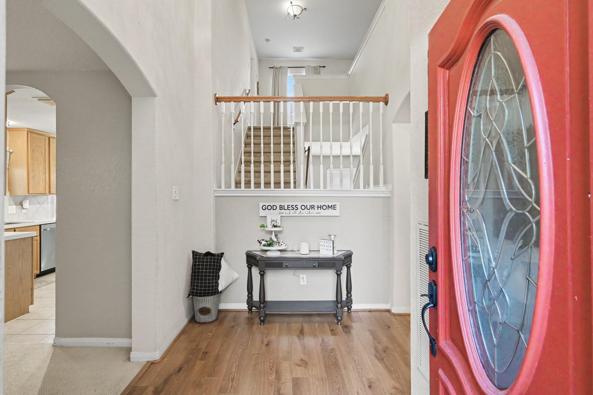 Image 4: Come on in!  Front door entry way features laminat