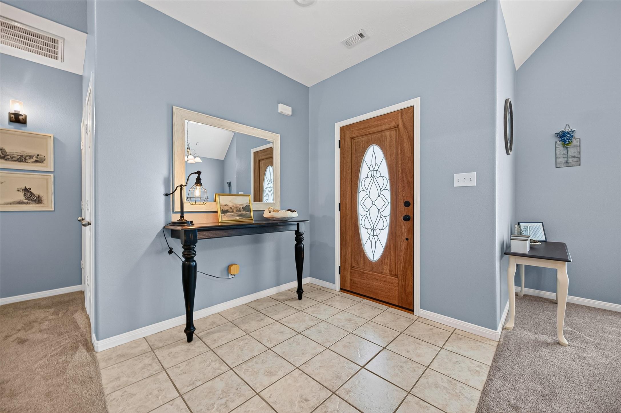 Image 4: Interior entryway complemented by cool toned walls
