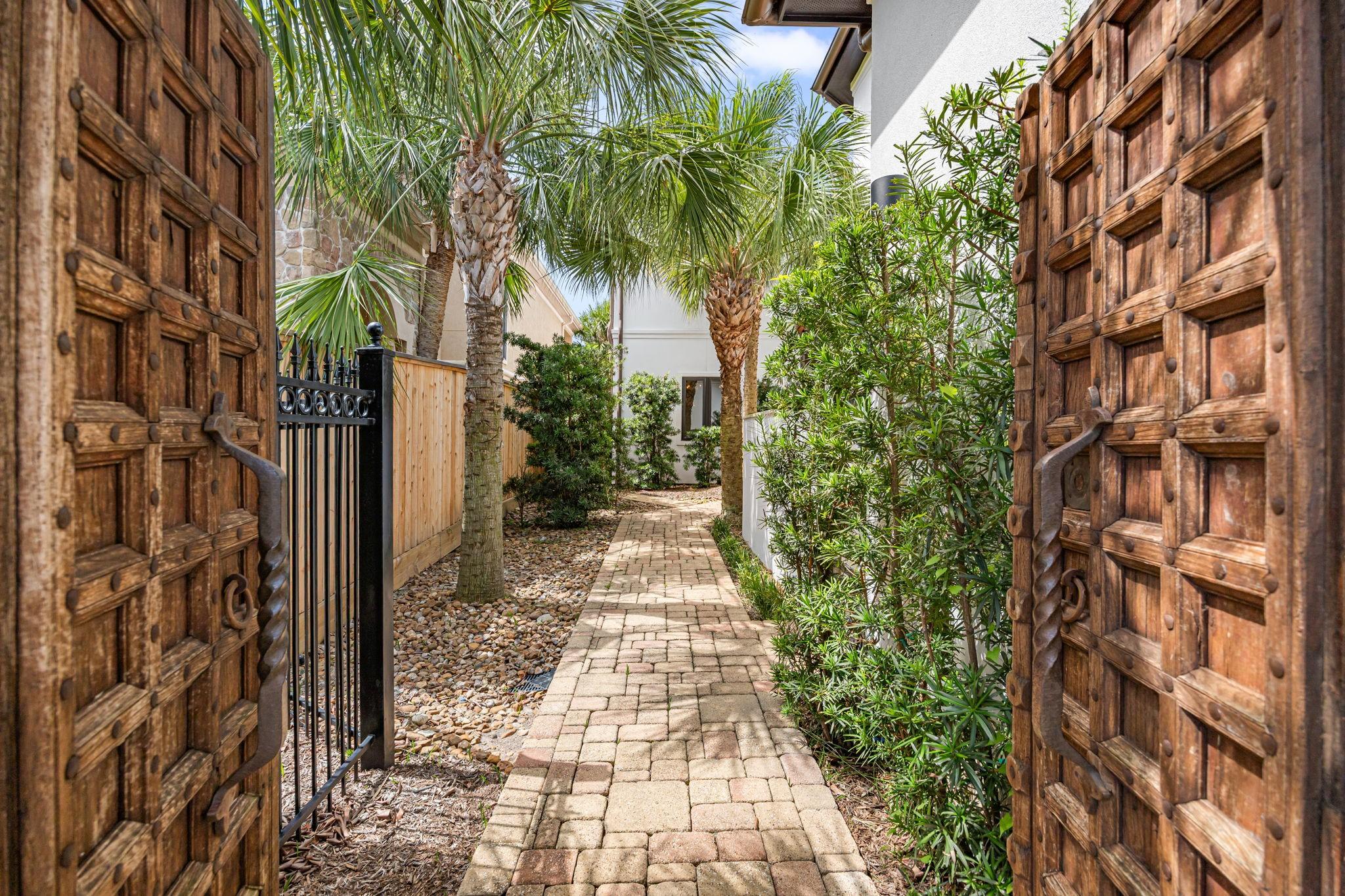 Image 3: A resort-style entry welcomes you through stunning