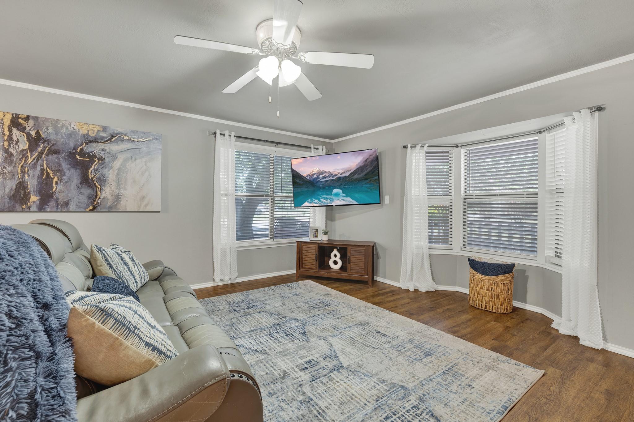 Image 3: Spacious living room open to dinning and kitchen.