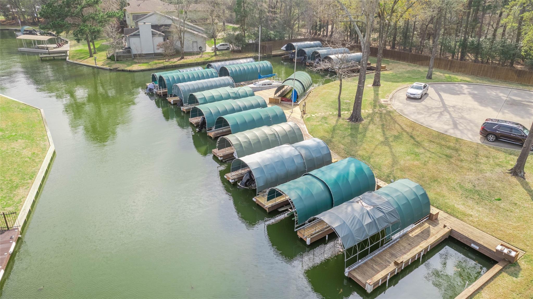 Image 3: This home comes with a BOAT SLIP & LIFT- love the