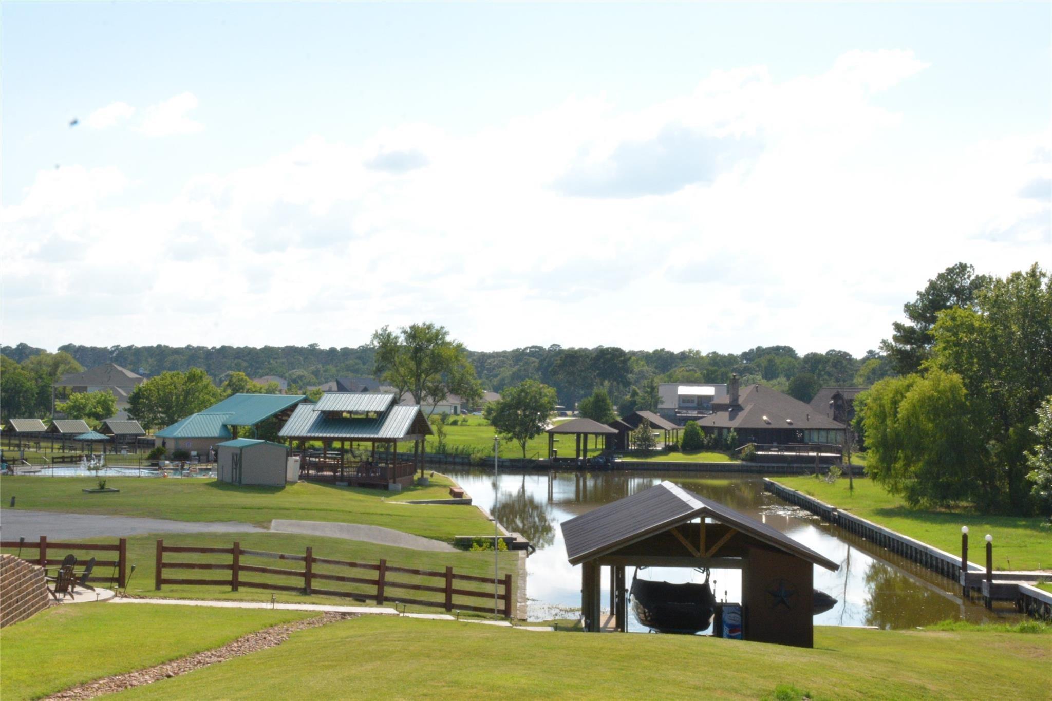 Image 1: The lush greenery and calm water throughout the co