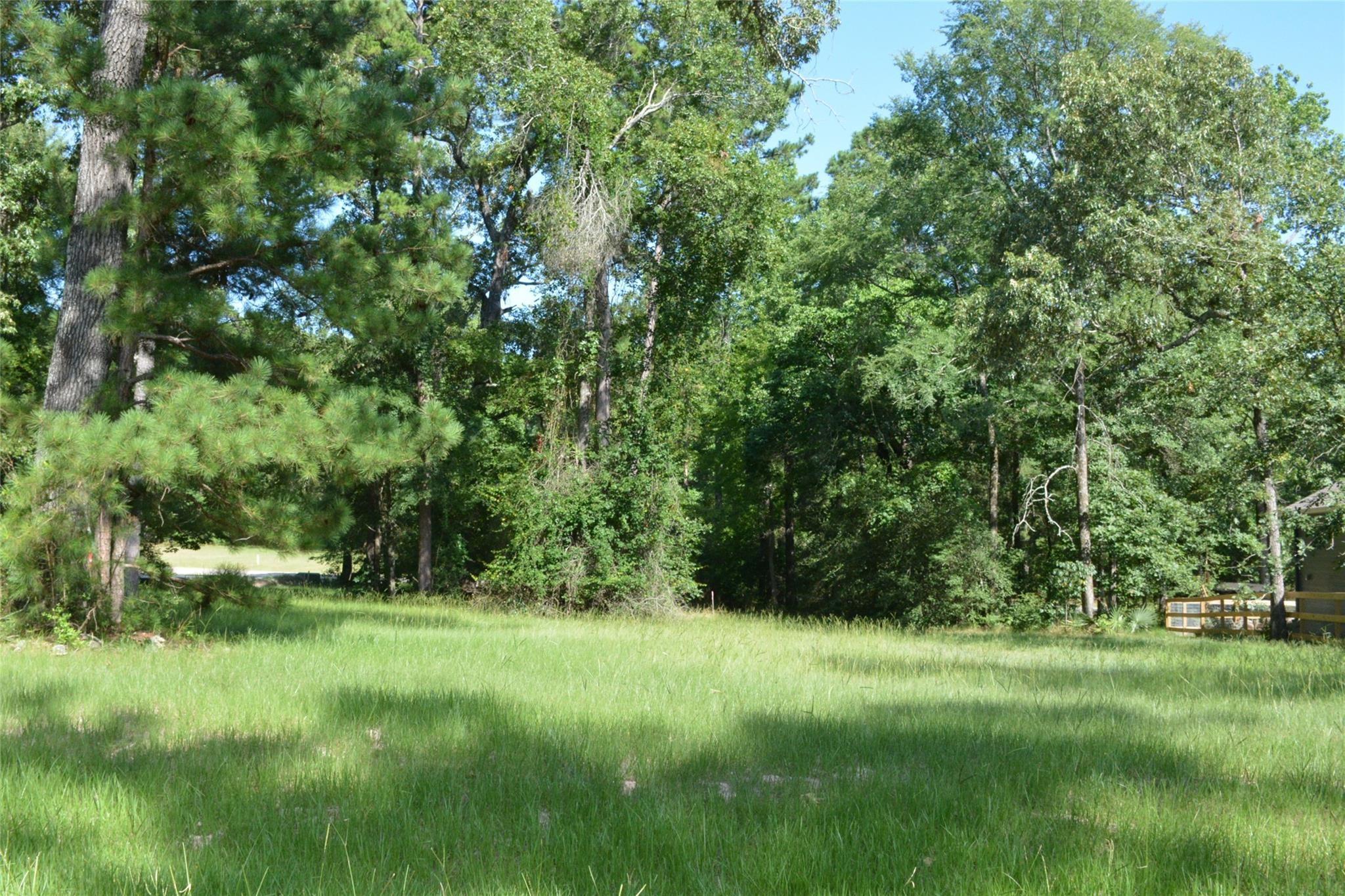 Image 3: This lot offers a peaceful and private setting. Id