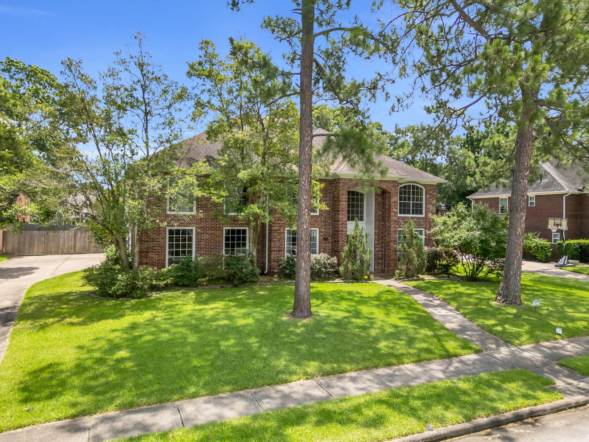 Image 2: Home sits on a large subdivision lot.