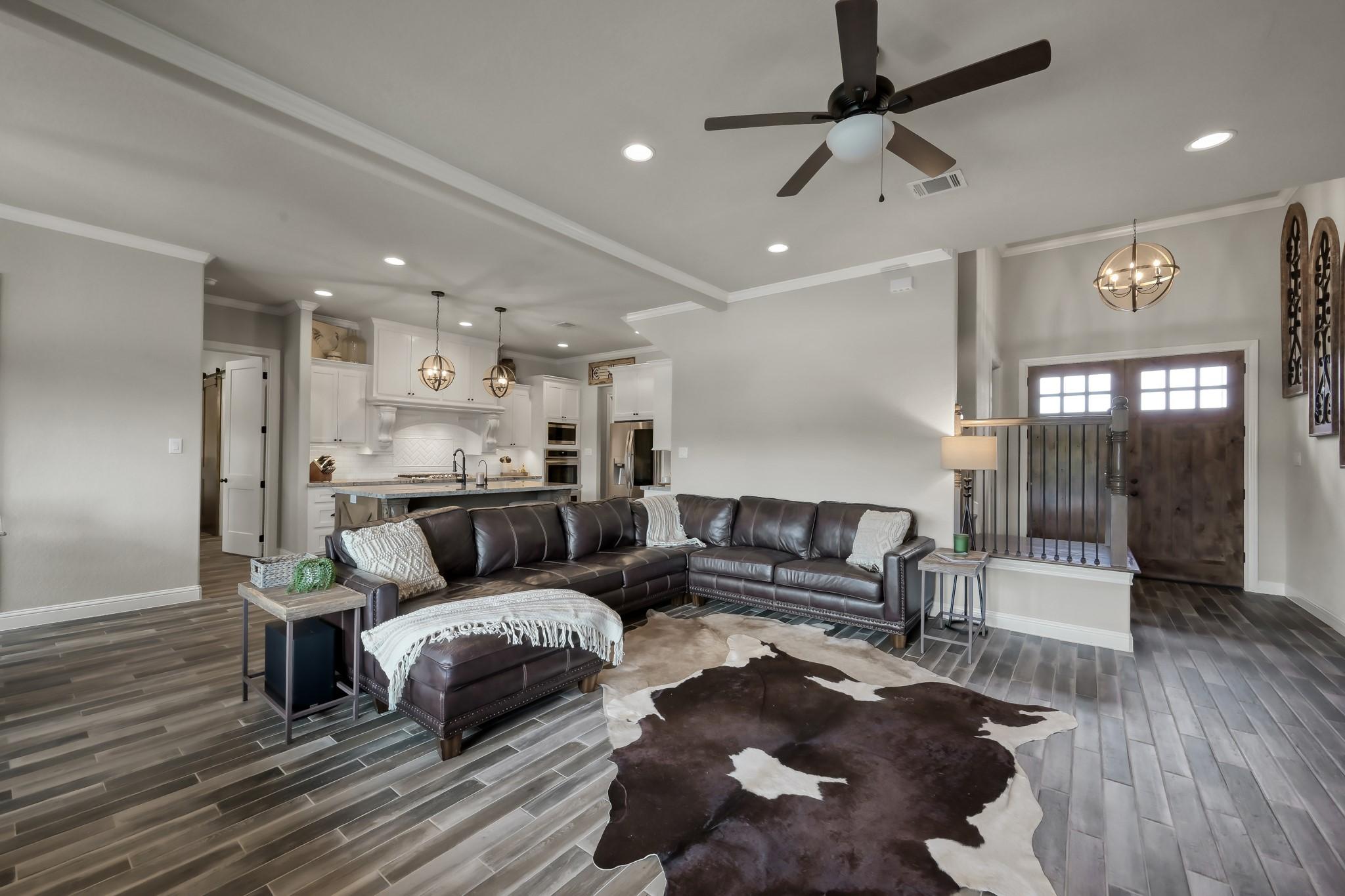 Image 4: Living area is a modern open-concept living space