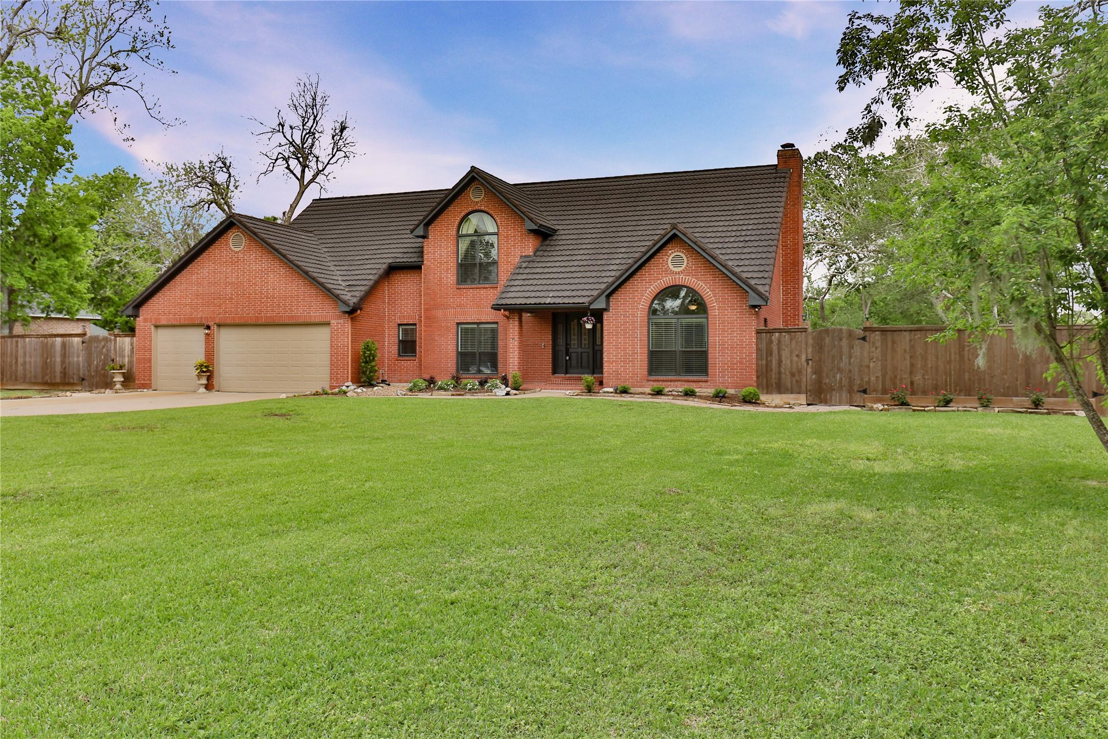 Image 4: Double gates on right side of the home