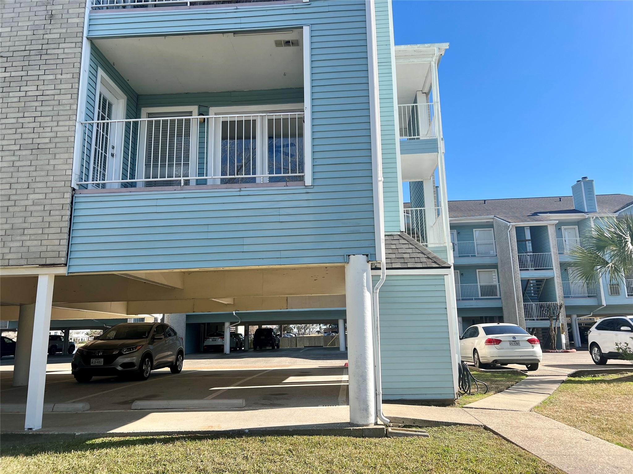 Image 1: Corner unit on first floor above parking