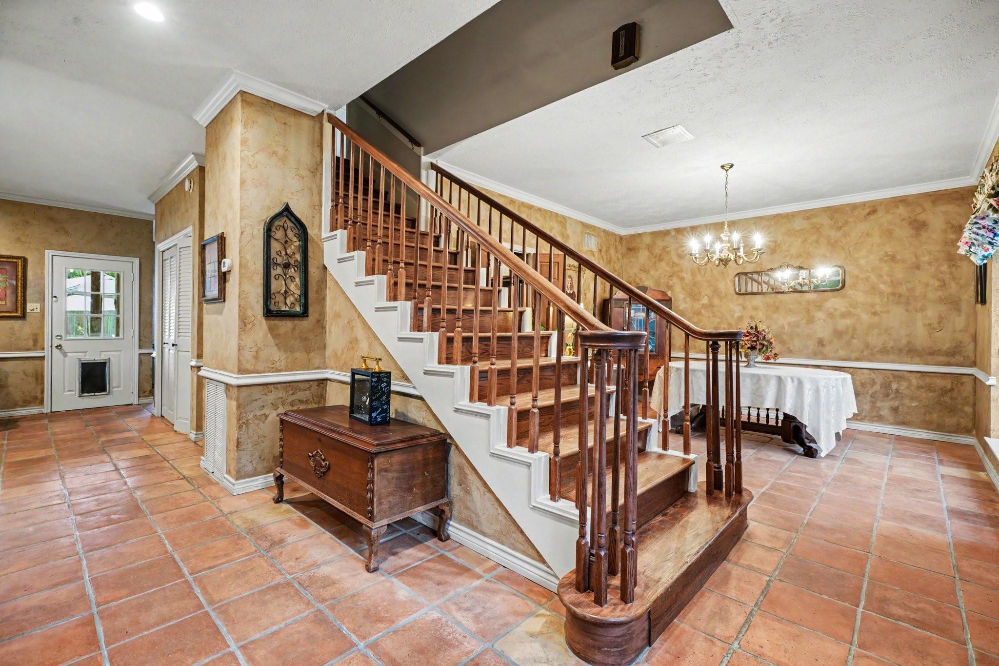 Image 3: Warm and inviting entry featuring terracotta tile