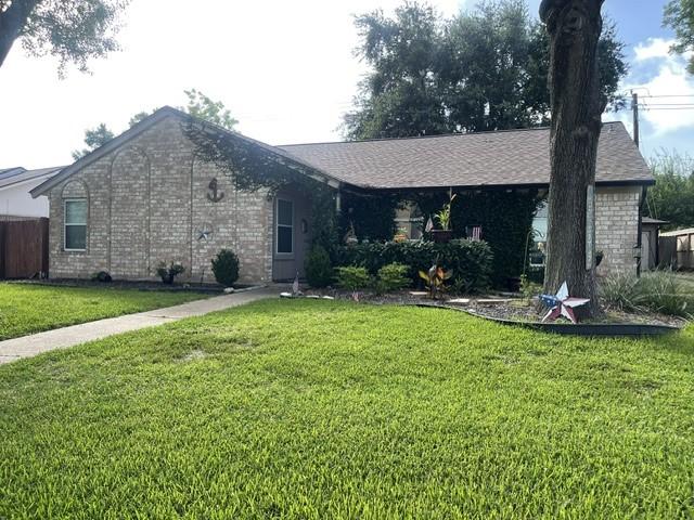Image 2: Charming brick home with a welcoming front entranc