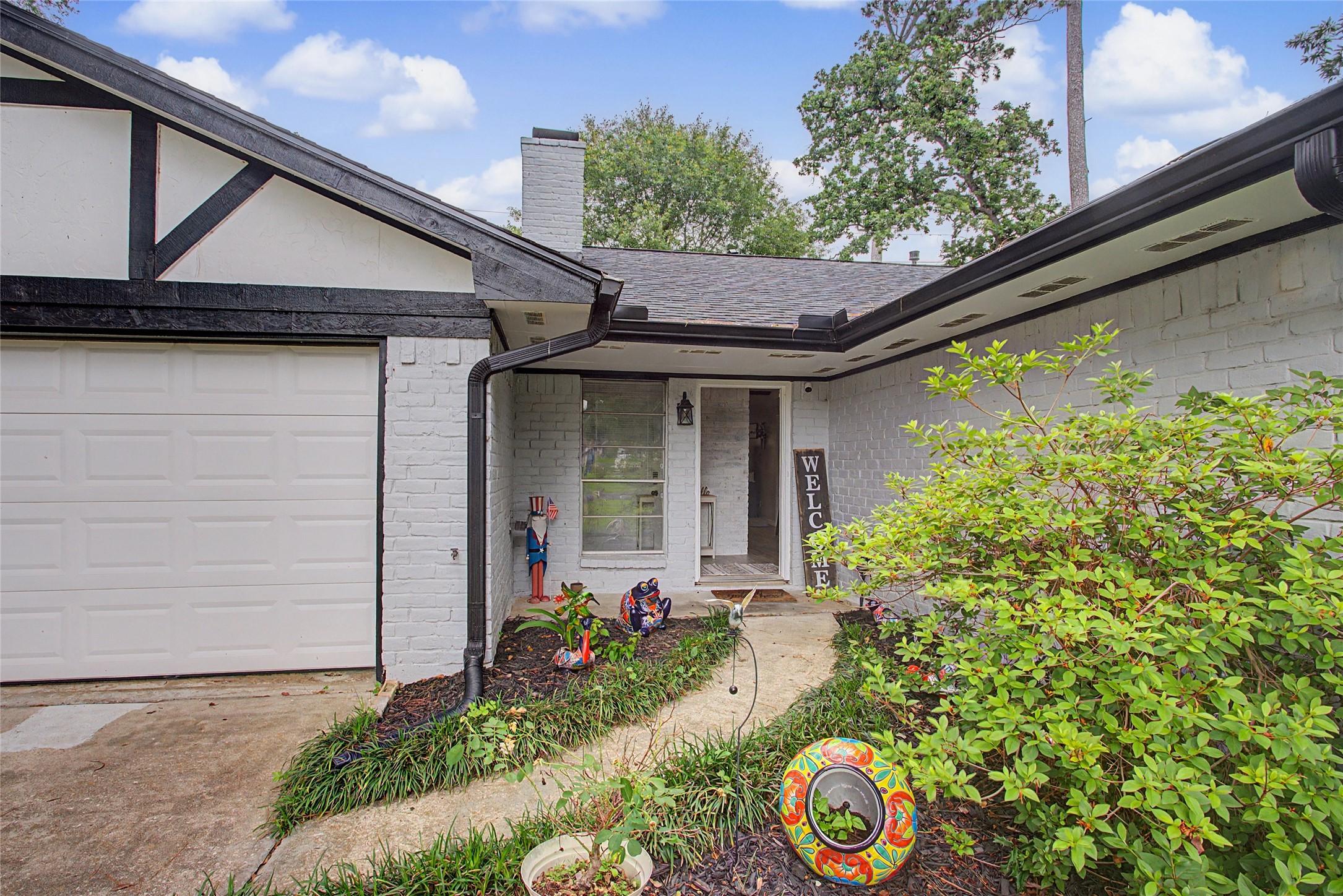 Image 4: Lush landscaping greets you in front!
