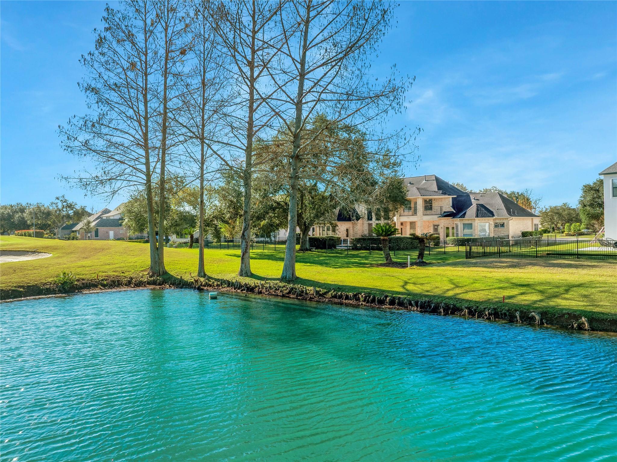 Image 4: The backyard overlooks a picturesque golf course a