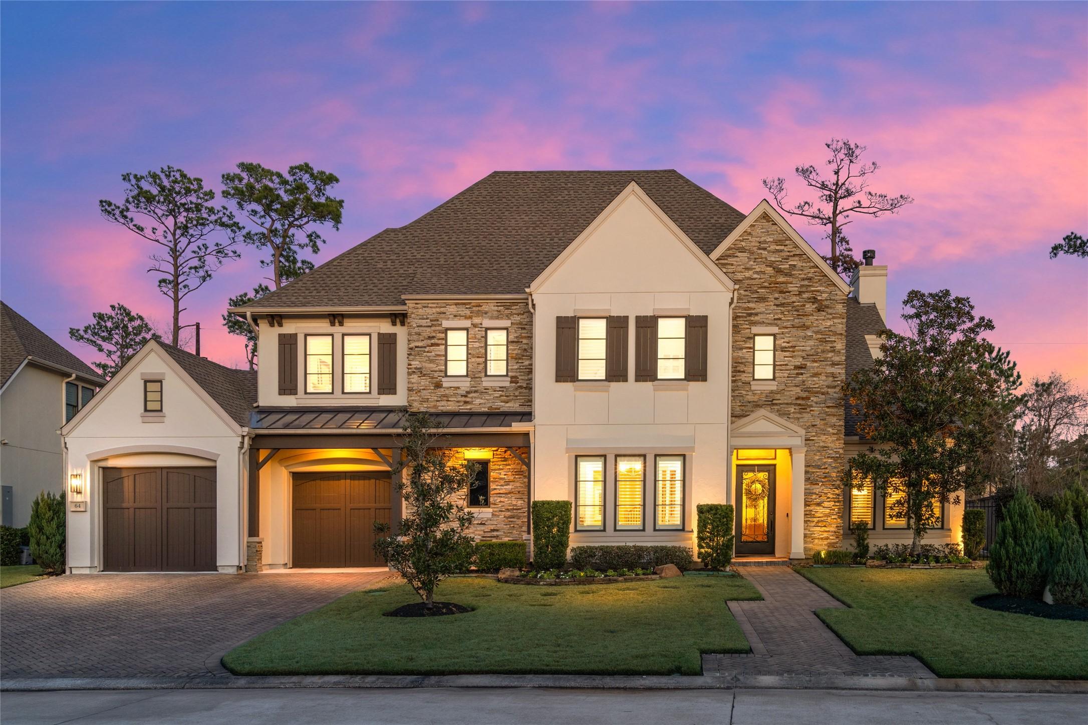 Image 2: This home exudes curb appeal with it's stacked sto