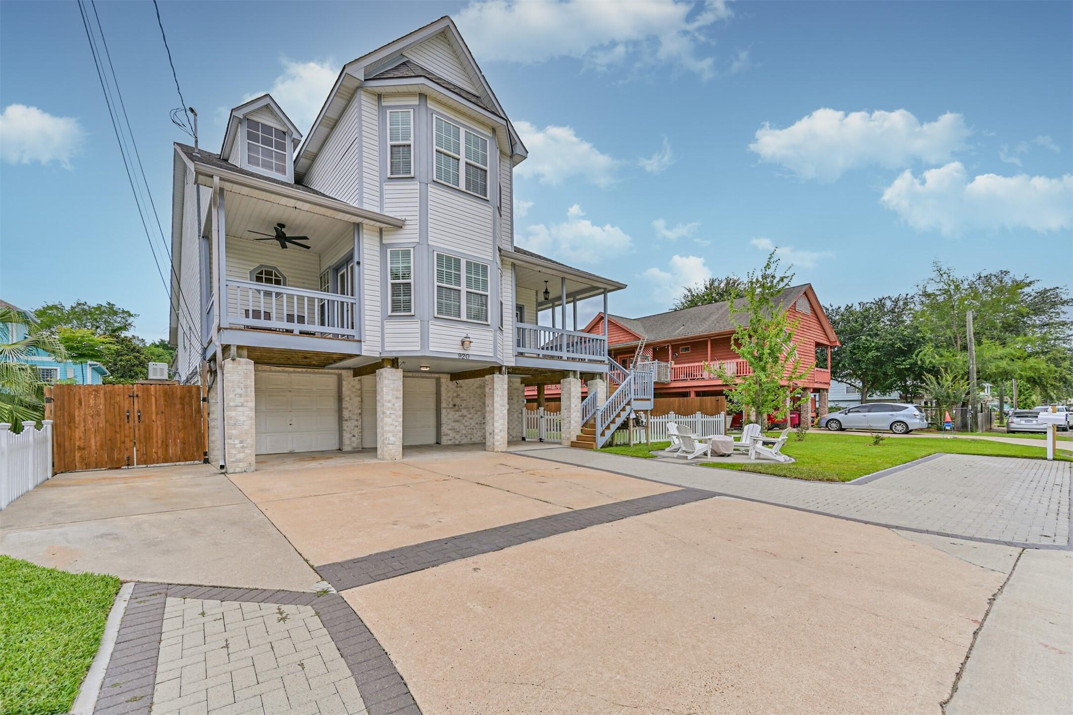 Image 1: This is a charming elevated home with a spacious d