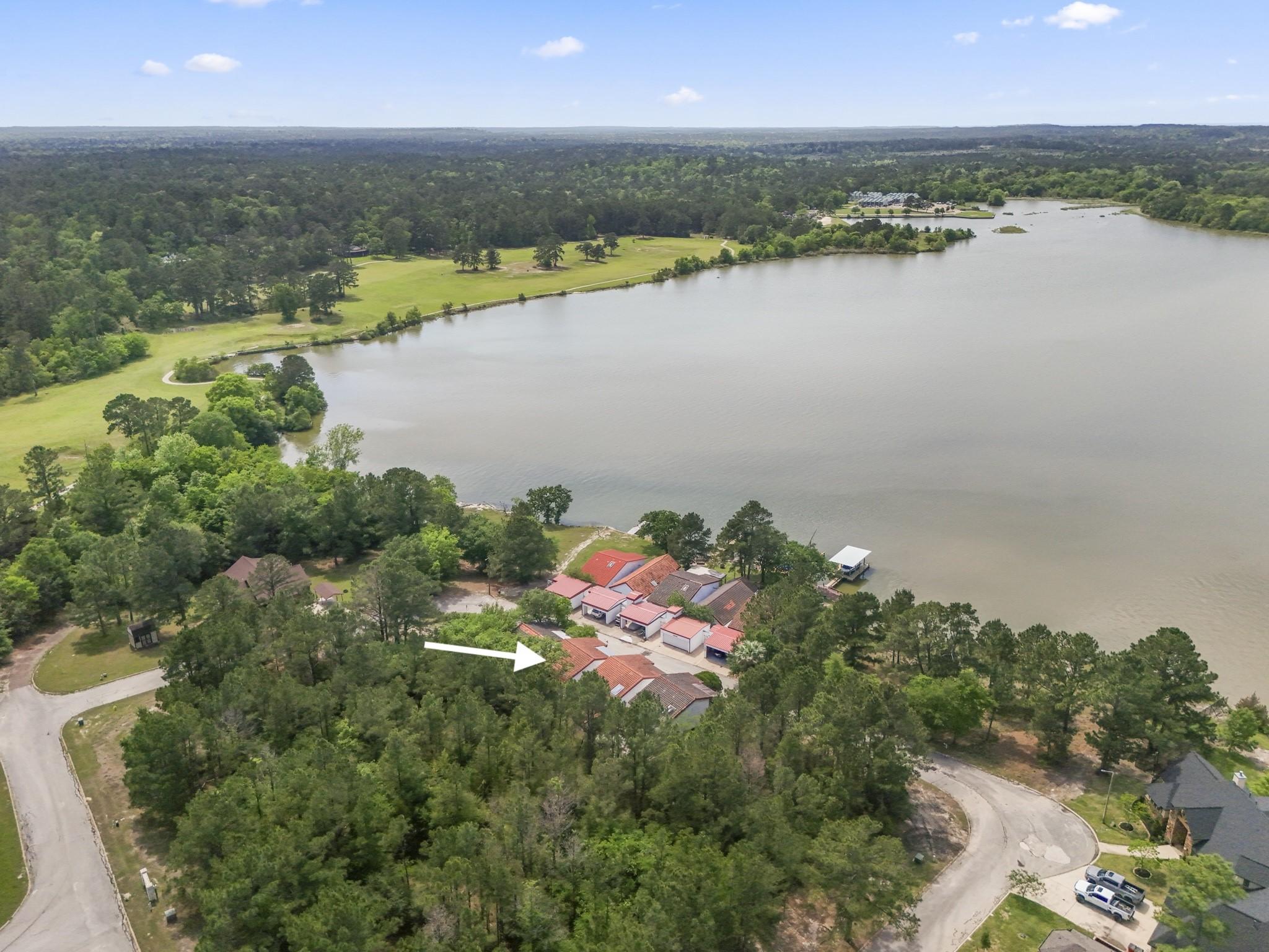 Image 4: A wider aerial perspective shows how the villas si