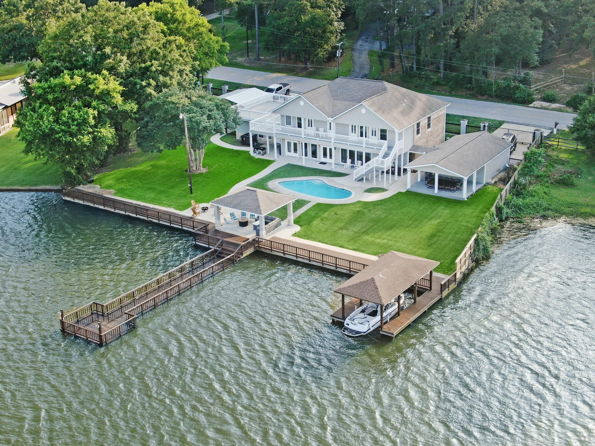 Image 1: Stunning waterfront estate featuring an expansive