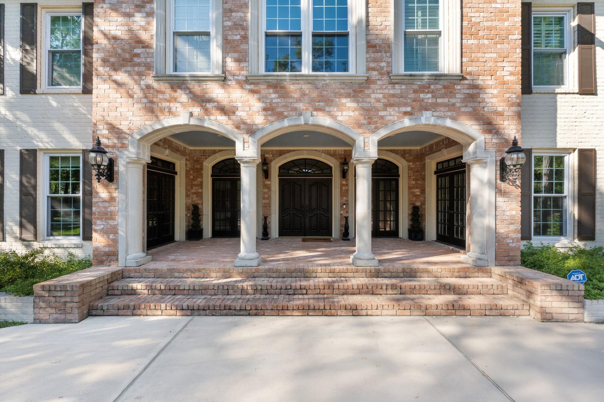 Image 4: A special porch warmly embraces the entry, invitin