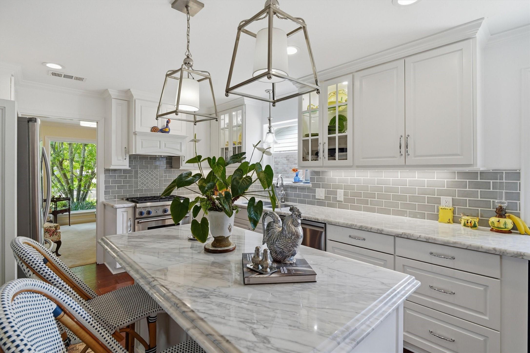 Image 1: Carrera marble countertops, handcrafted cabinetry,