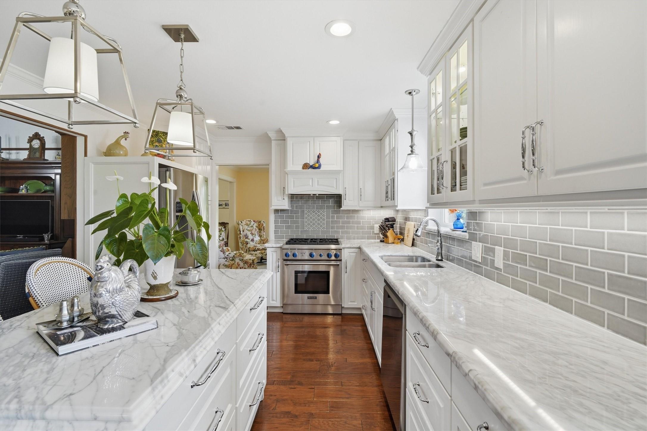 Image 3: Custom pull-out pantry storage to the right of the