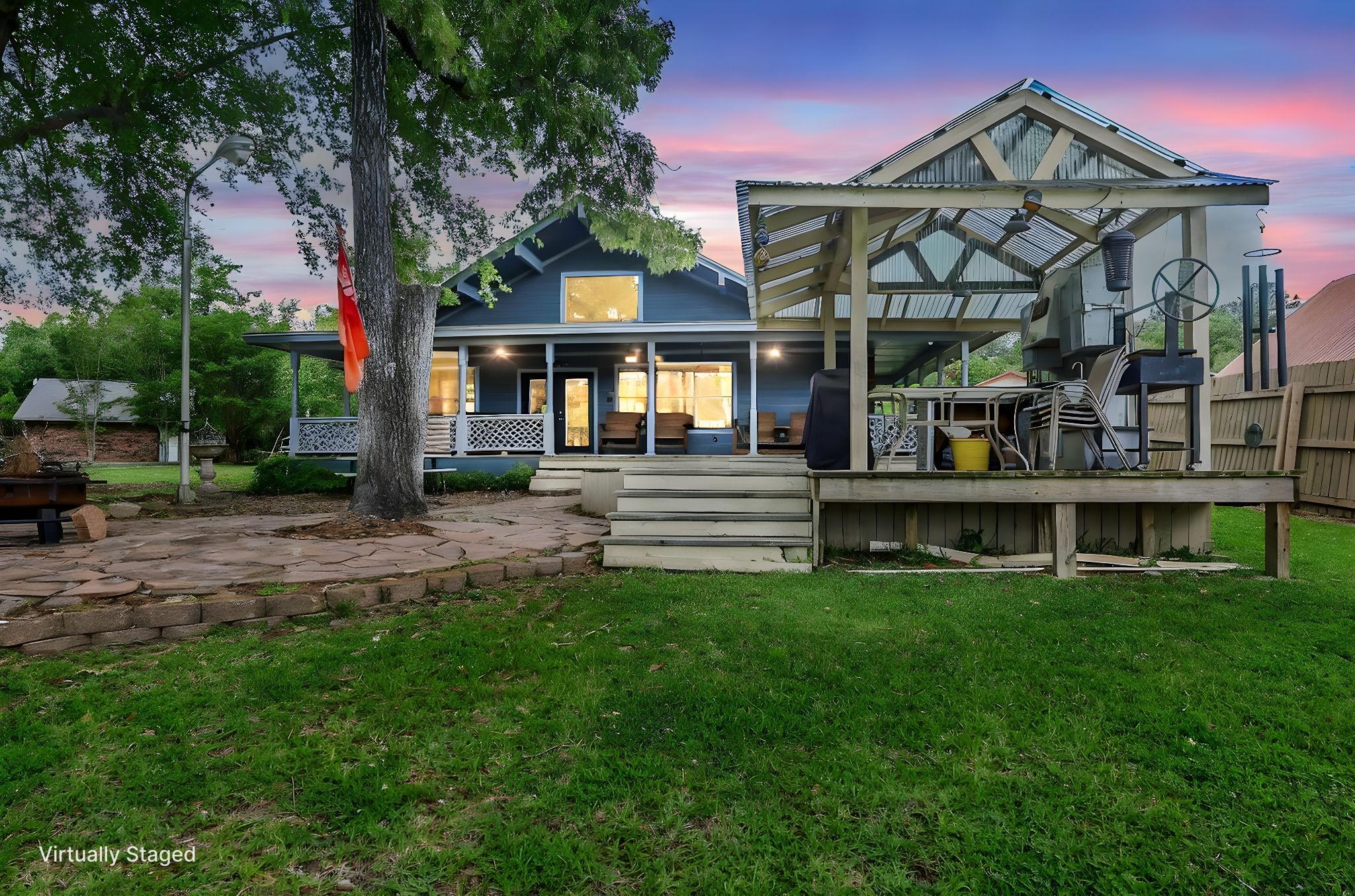 Image 2: The home presents an inviting exterior, where a ge