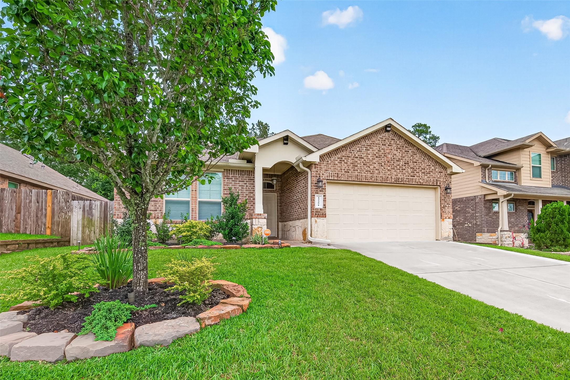 Image 1: This inviting home features a charming brick exter
