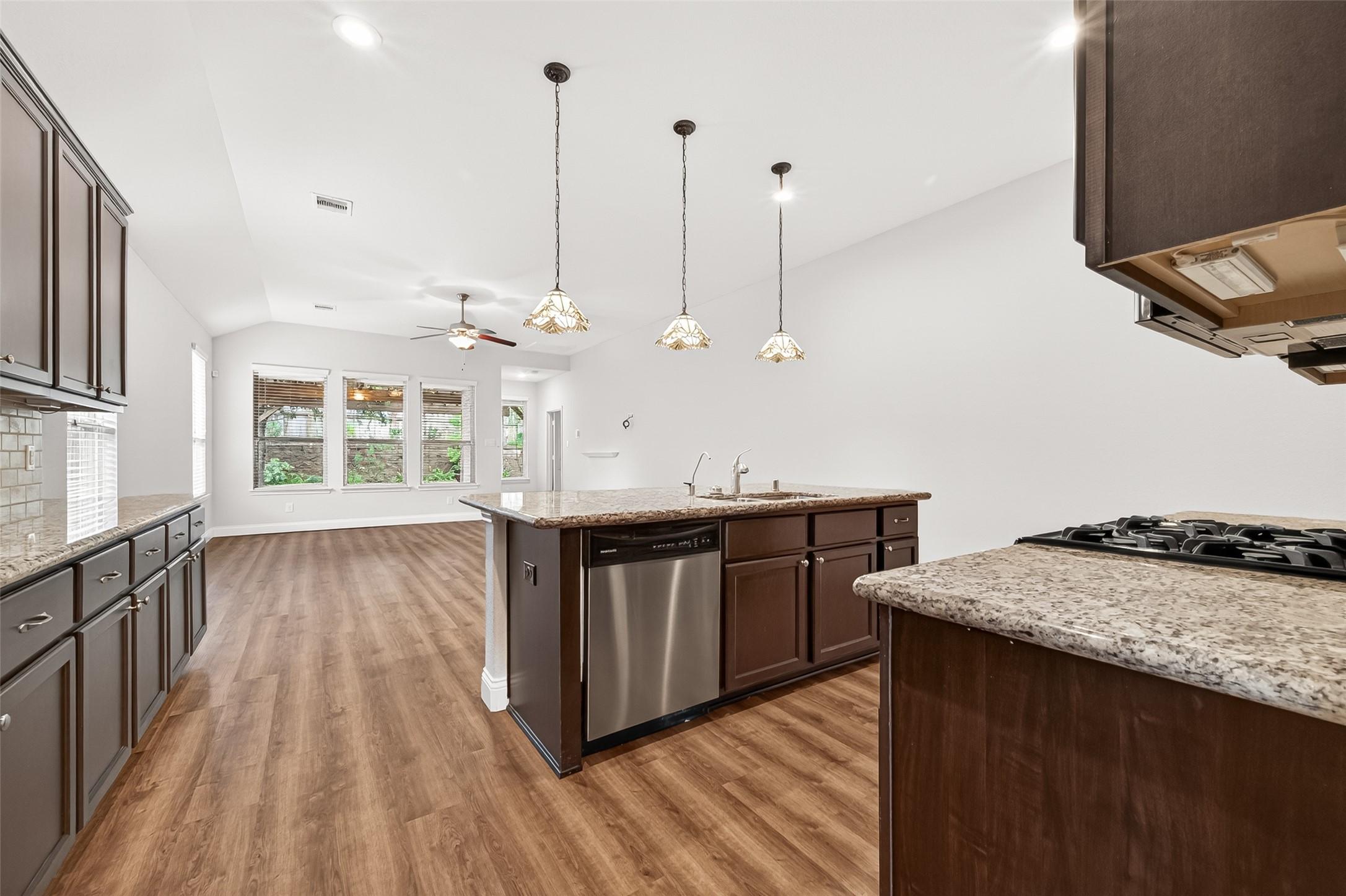 Image 3: This photo showcases a modern, open-concept kitche