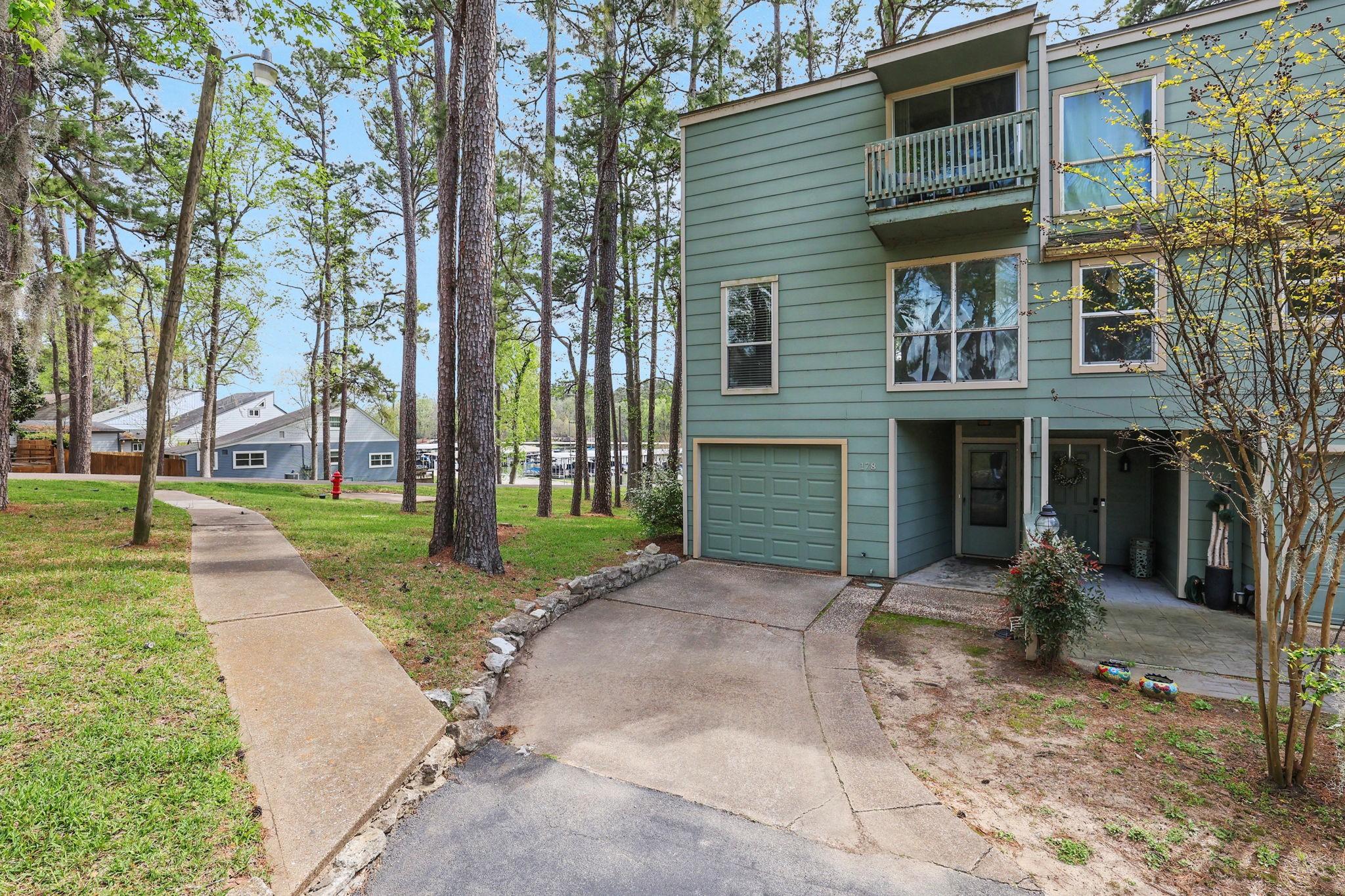 Image 3: There is an attached garage for storage or parking