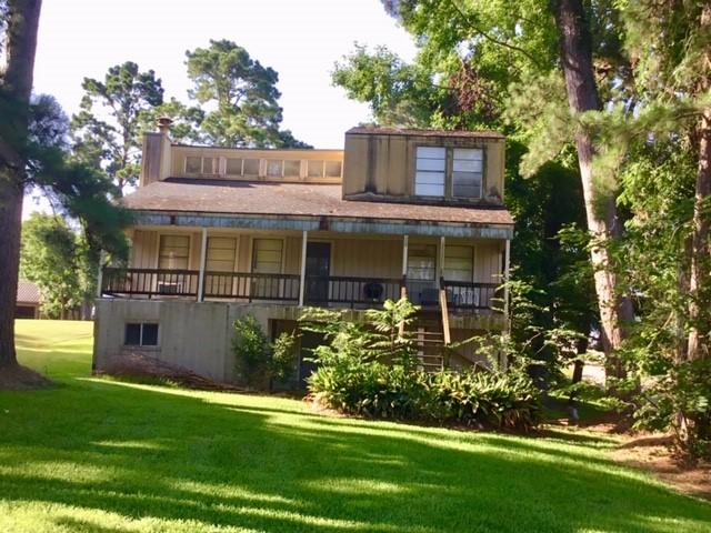 Image 2: Rear of home with large porch