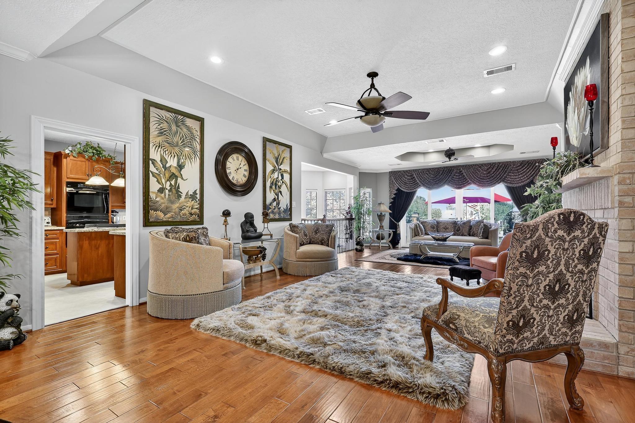 Image 3: Spacious and open living area featuring a cozy fir