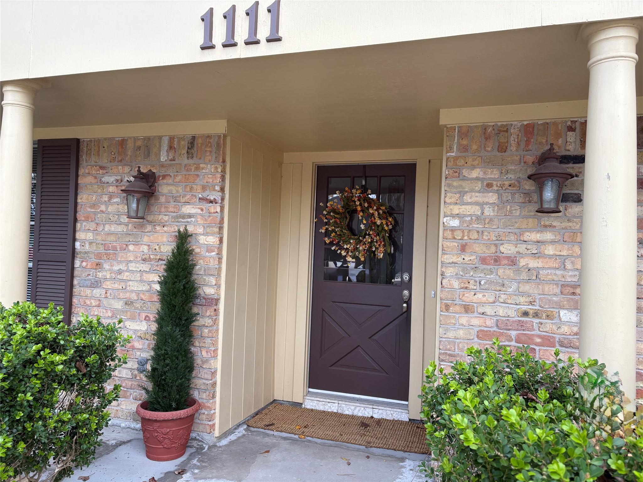 Image 3: This elegant brick home boasts fresh 2025 exterior