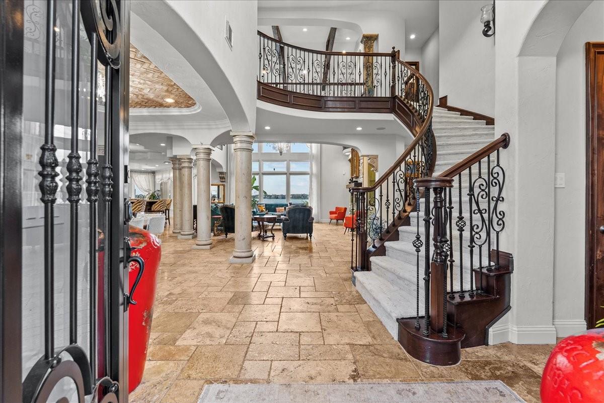 Image 4: Step into elegance through this stunning entryway,