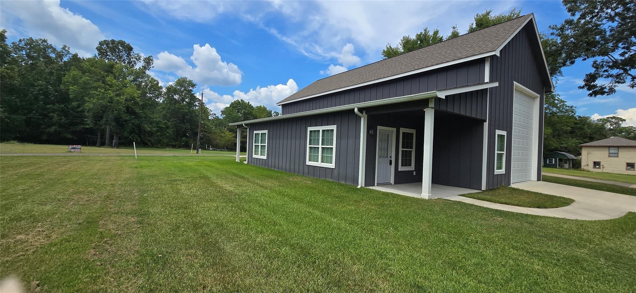 Image 3: View of yard and garage.