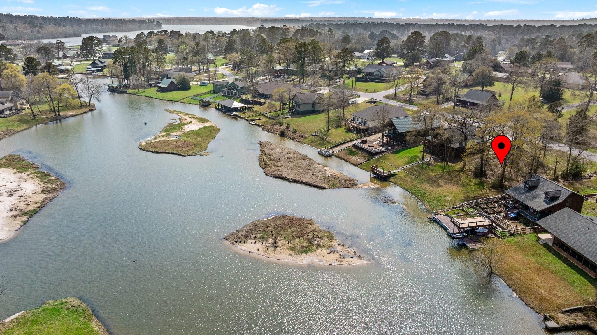 Image 2: Lake Conroe awaits just on the horizon here!
