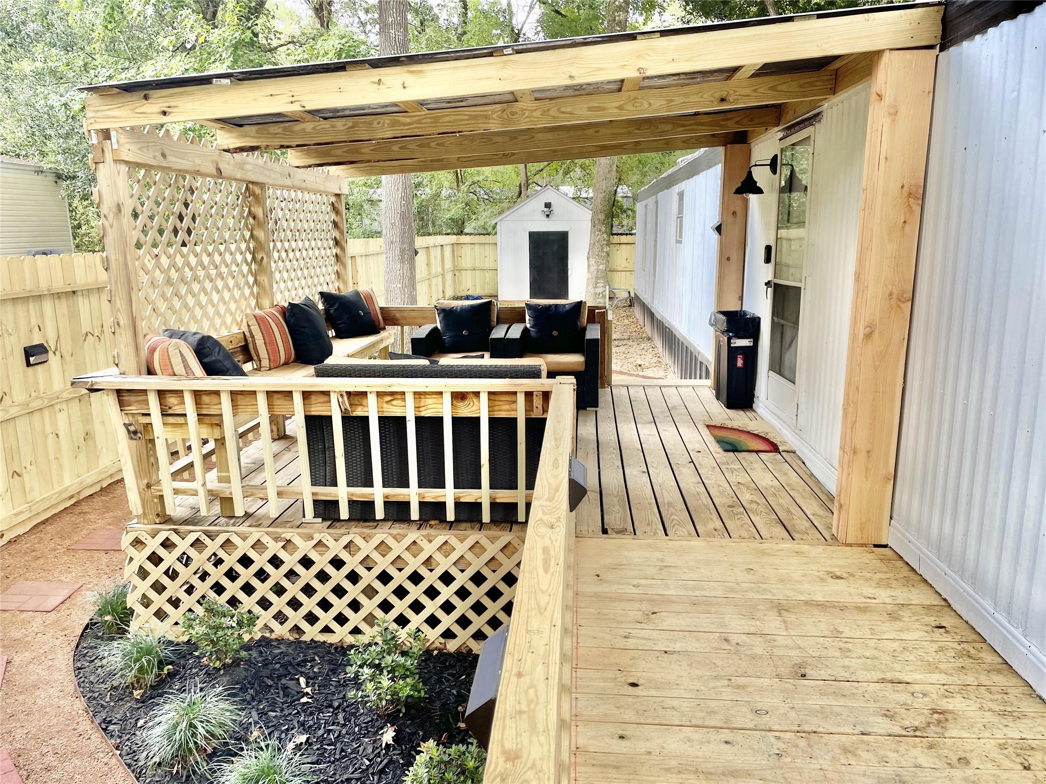 Image 2: Covered patio has new roof and refreshed cushions