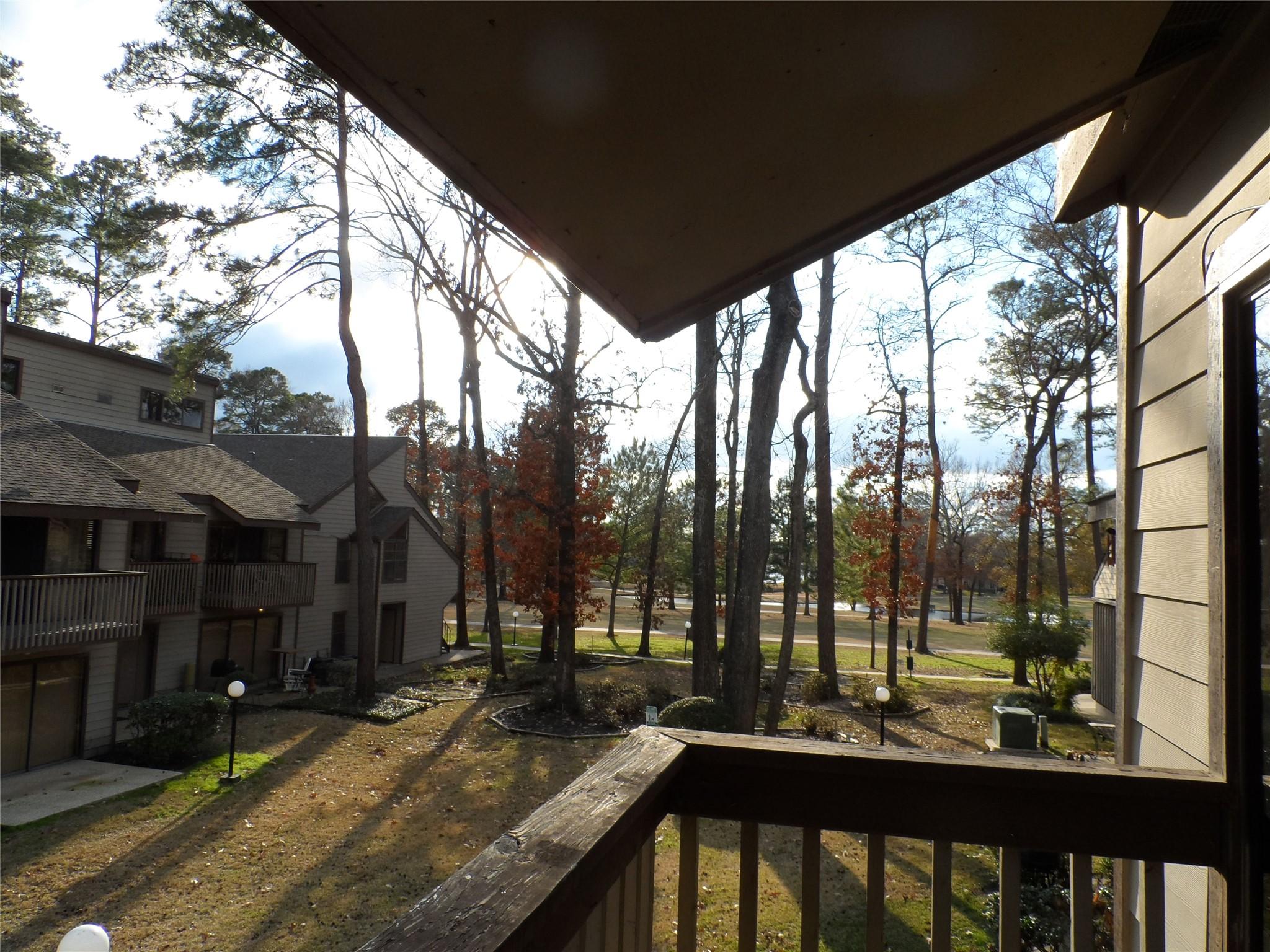 Image 1: Private balcony overlooking mature trees and lands