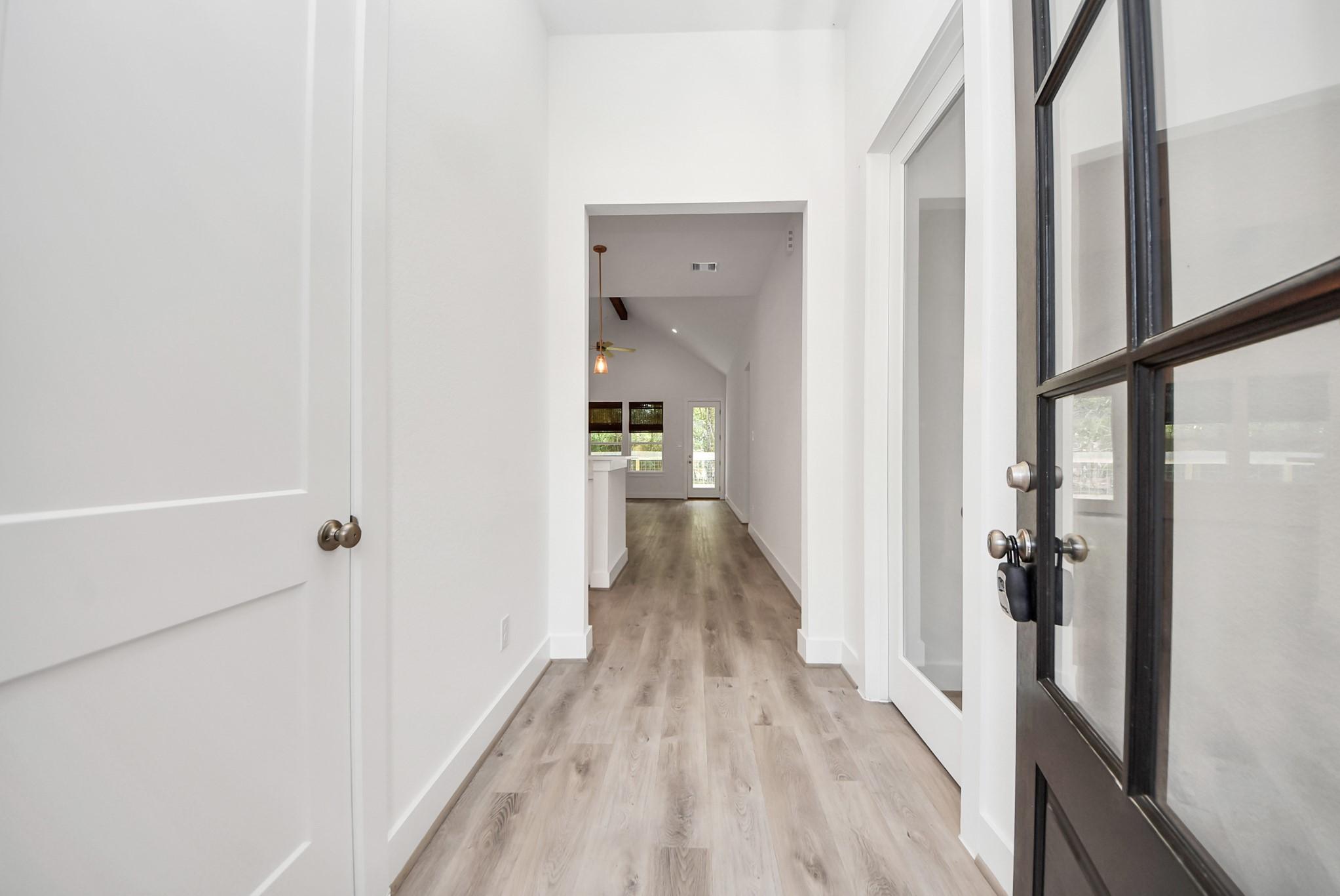 Image 4: Bright hallway featuring tall ceilings and plenty