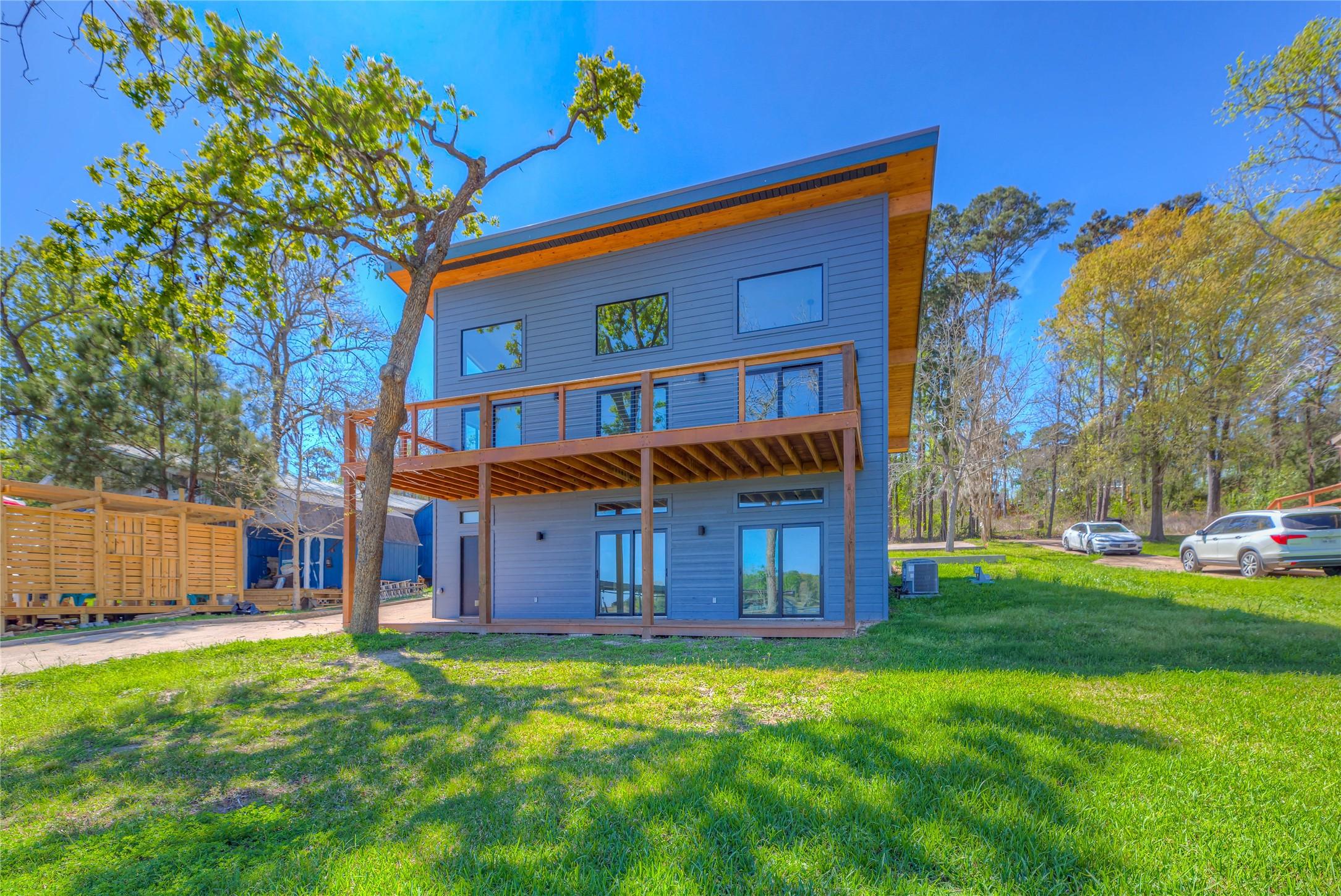 Image 3: BACK VIEW OF THIS BEAUTIFUL HOME- LOTS OF WIDOWS B