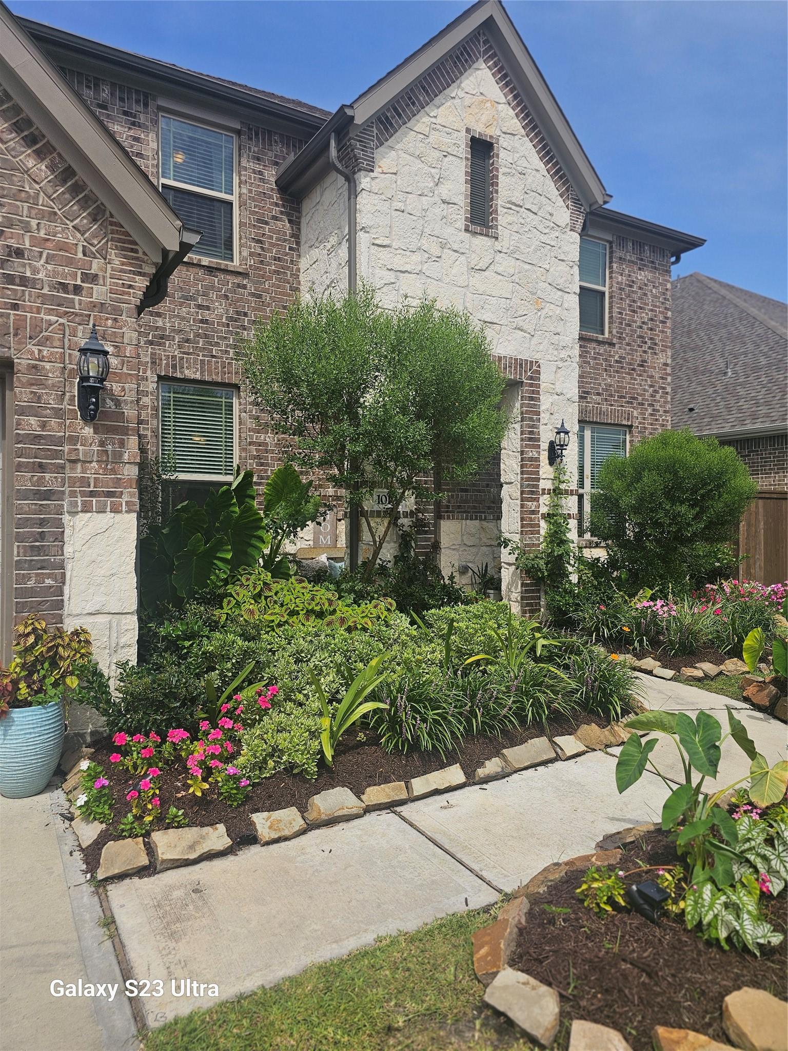 Image 3: Gorgeous and inviting landscaping welcomes you hom