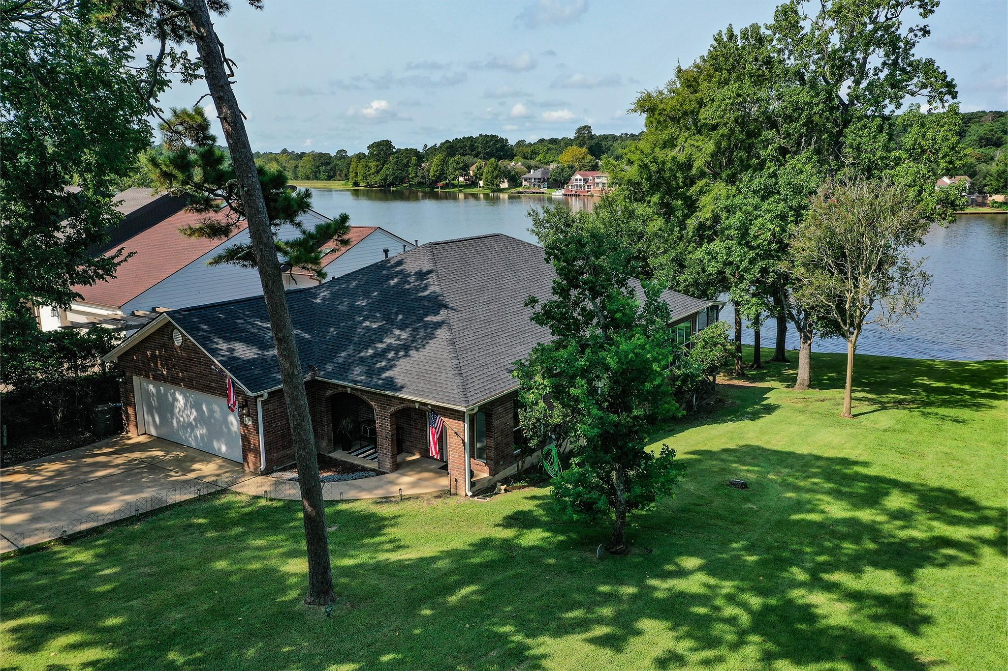 Image 4: Aerial view of lakeshore. Home is just steps from