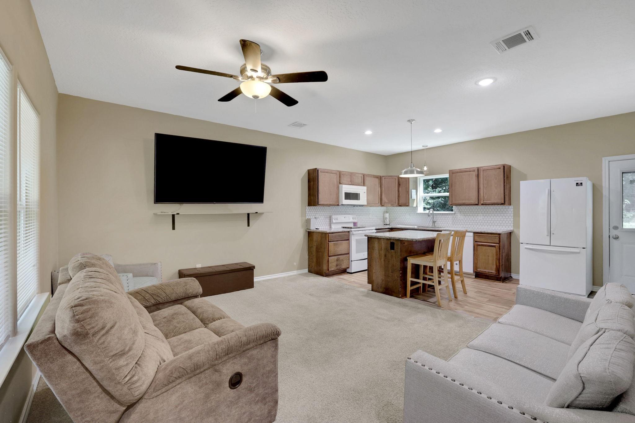 Image 3: Step into your open concept living and kitchen wit