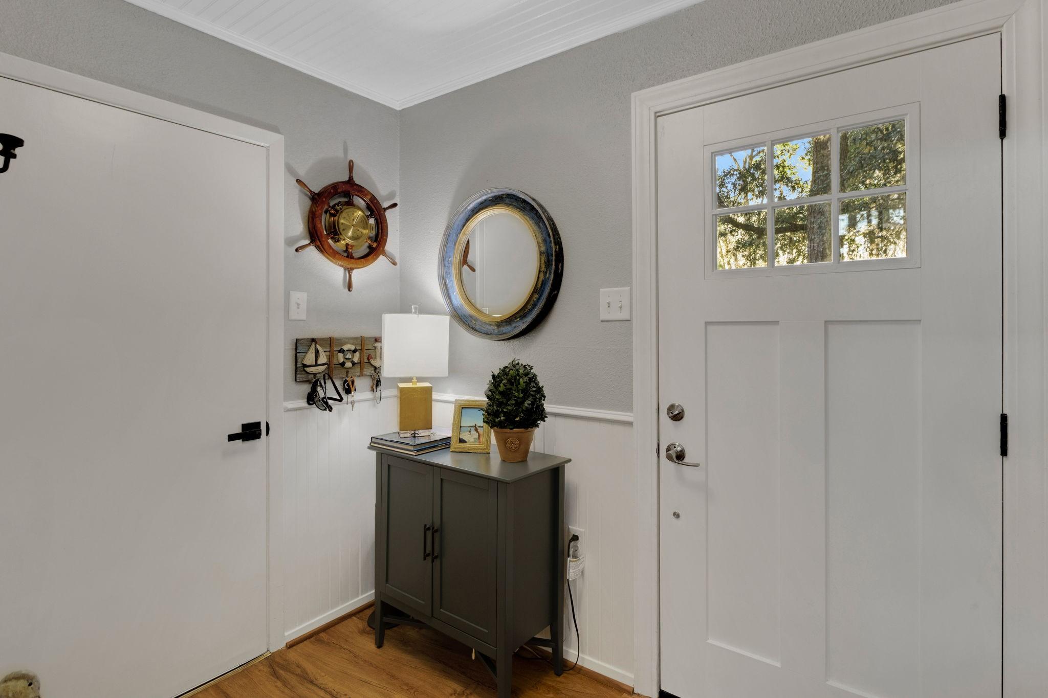 Image 3: Welcome home! The entrance hallway features wainsc