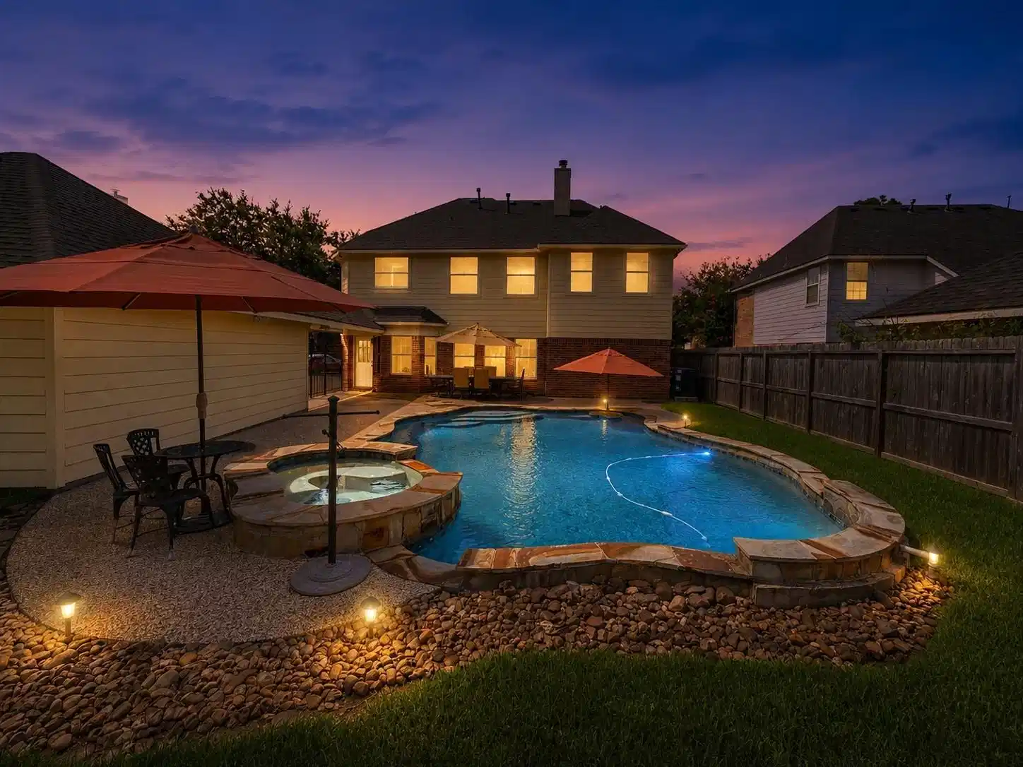 Image 1: Experience serene evenings in this inviting backya
