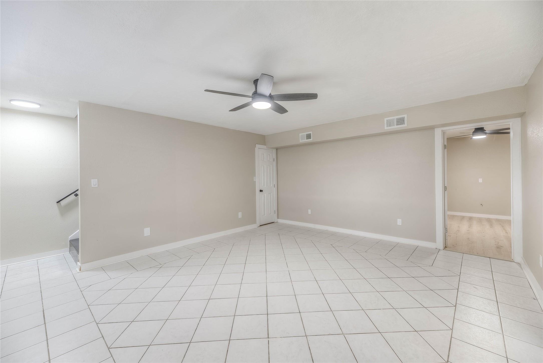 Image 3: This inviting living room serves as the entryway,