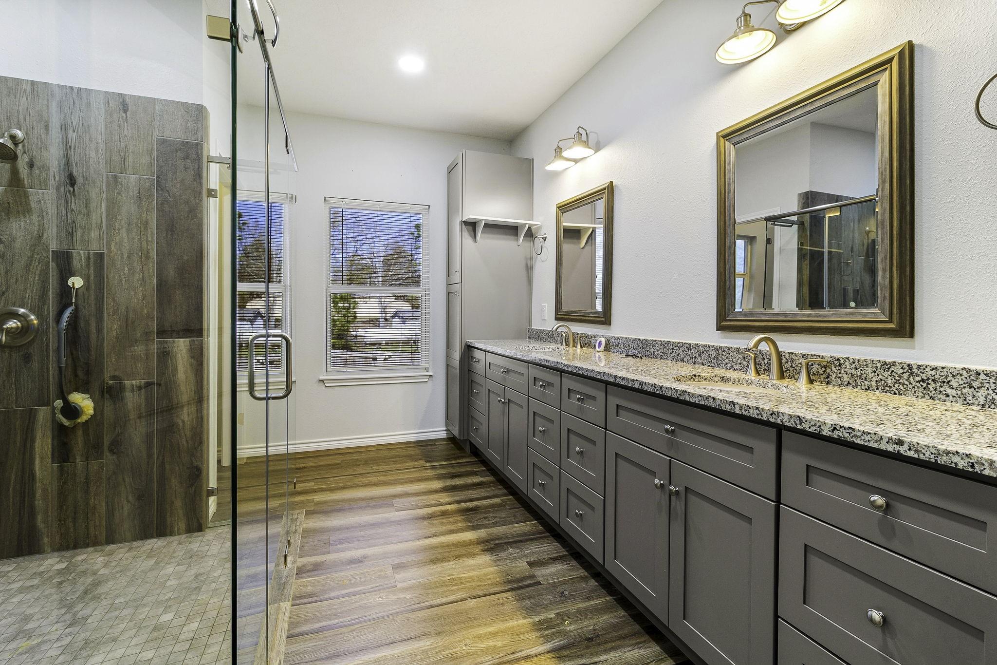 Image 3: Primary bathroom with luxury walk in shower