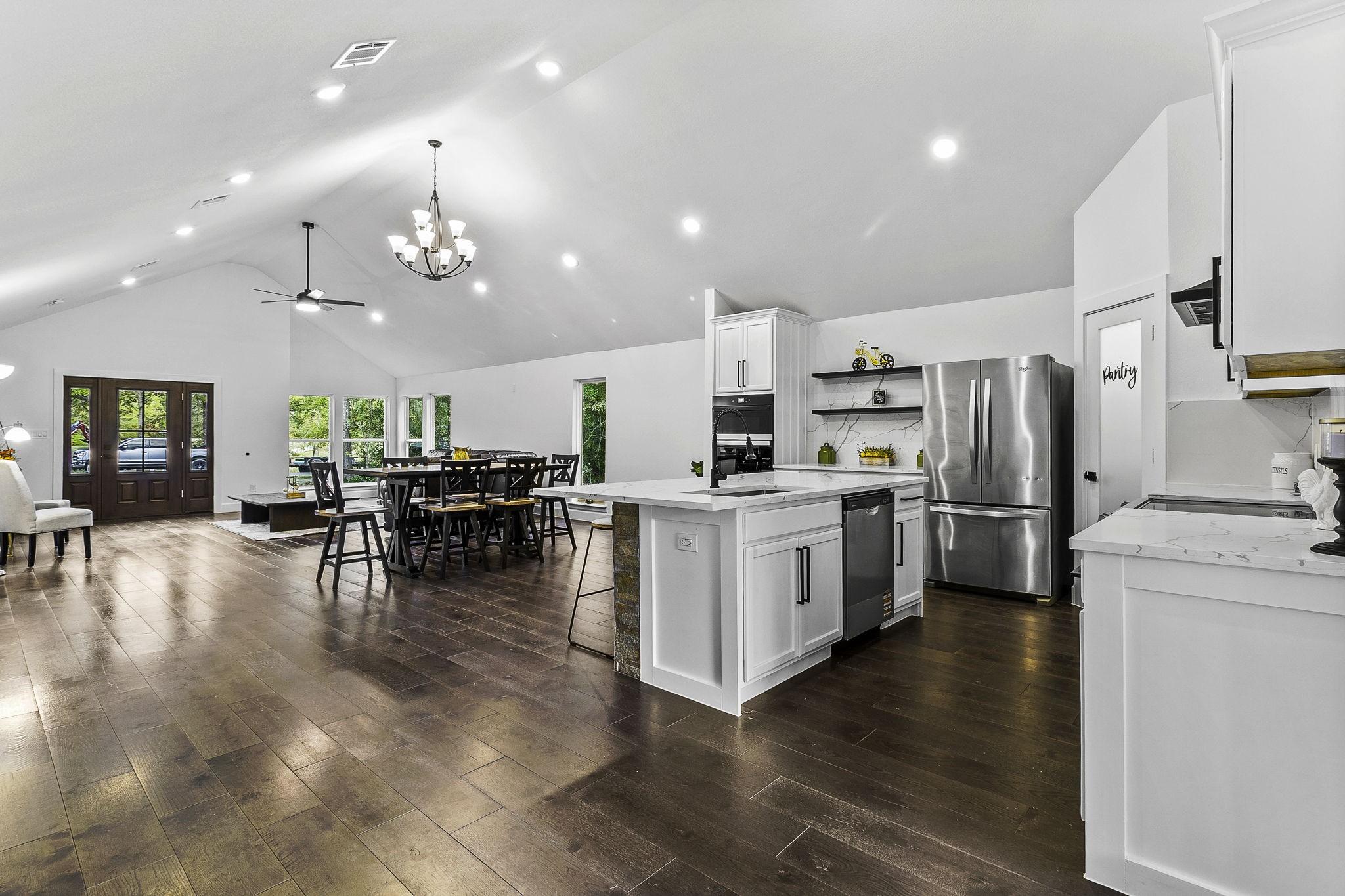 Image 1: This photo showcases a spacious open-concept livin