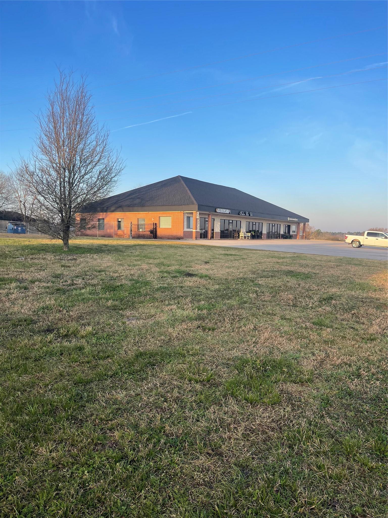 Image 2: Building Next to the Property