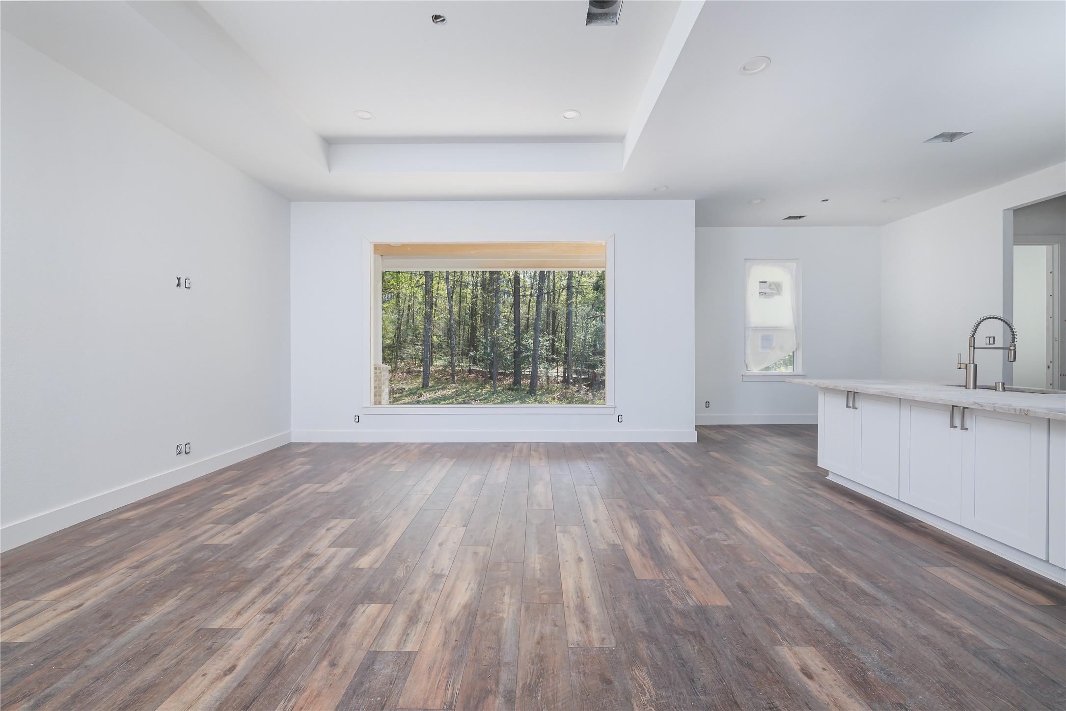 Image 4: Bright, airy living space anchored by a stunning o